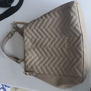 Bebe beige faux leather shoulder bag.
